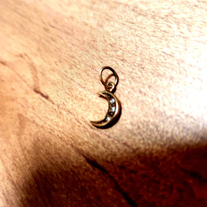 Close-up of Agete necklace charm model agete with elegant design on a silver chain