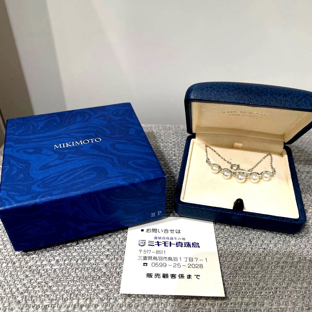 Mikimoto necklace featuring 5 pearls on silver chain with a blue dedicated case