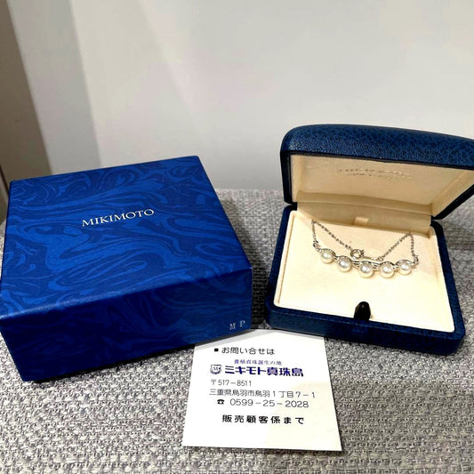 Mikimoto necklace featuring 5 pearls on silver chain with a blue dedicated case