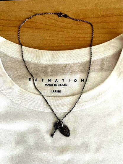 Agete silver necklace with key and emblem charms, 400mm length, slight blackening finish