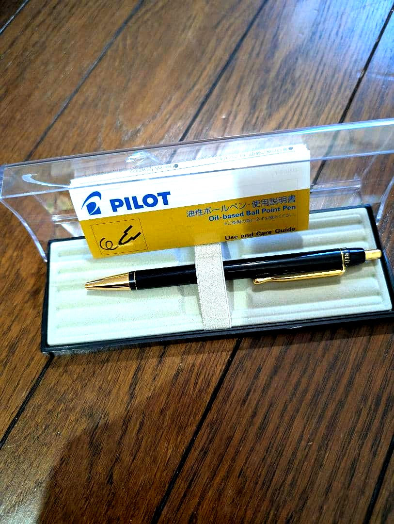 PILOT Oil-Based Ballpoint Pen in black with gold clip and tip shown with instruction manual