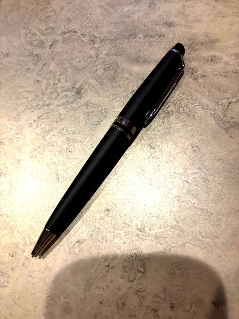Black WATERMAN ballpoint pen with sleek design and silver clip on white background