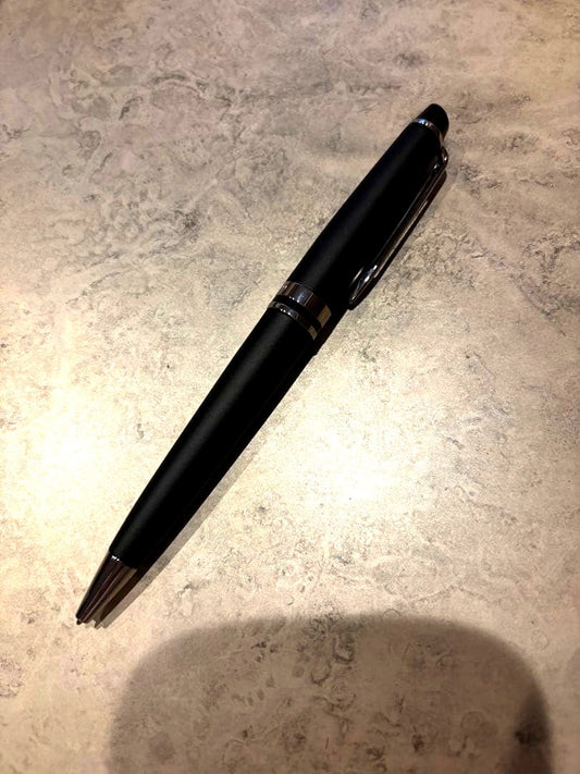 Black WATERMAN ballpoint pen with sleek design and silver clip on white background