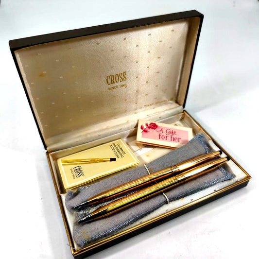 Cross Classic Century gold ballpoint pen and pencil set with blue ink, metal clipless design
