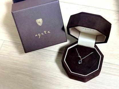 Agete silver necklace with a small blue topaz pendant 0.82 cm vertical and 0.63 cm horizontal on a 50 cm chain with box