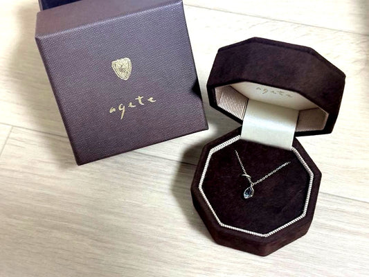 Agete silver necklace with a small blue topaz pendant 0.82 cm vertical and 0.63 cm horizontal on a 50 cm chain with box