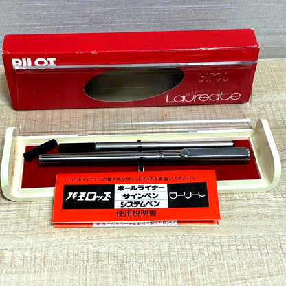 Pilot ballpoint pen with silver stripe design and included protective case and manual