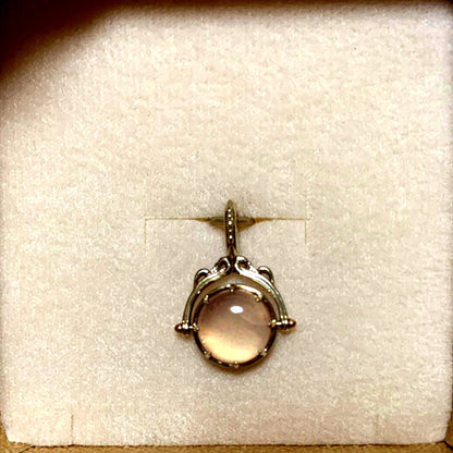 Agete 33rd anniversary charm accessory with intricate design, shown on a white background