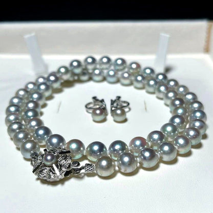 Akoya pearl necklace and earring set with round 7.0-7.4mm pearls on silver metal in green tone, necklace length 46.5 cm