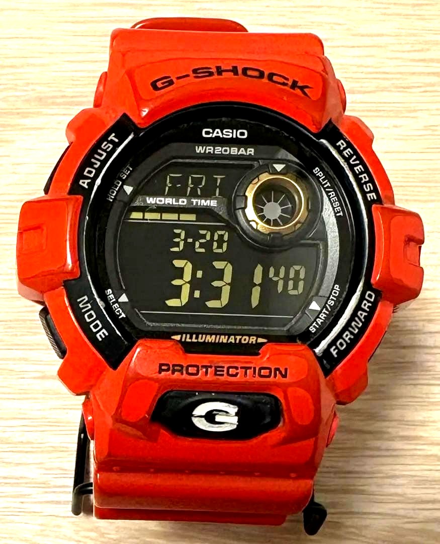 Casio G-Shock G-8900A red watch with digital display, 20 ATM water resistance, and stopwatch feature