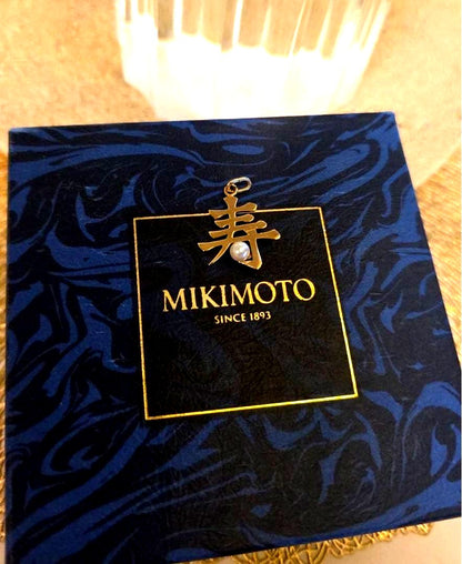 Mikimoto Kotobuki Motif Necklace in pristine condition with pearl and intricate design