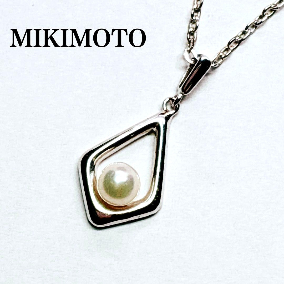 Mikimoto Akoya baby pearl necklace with 38 cm silver chain and engraved clasp shown on white background