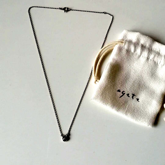 agete necklace with drop motif and transparent stone on a 40 cm chain displayed on white background