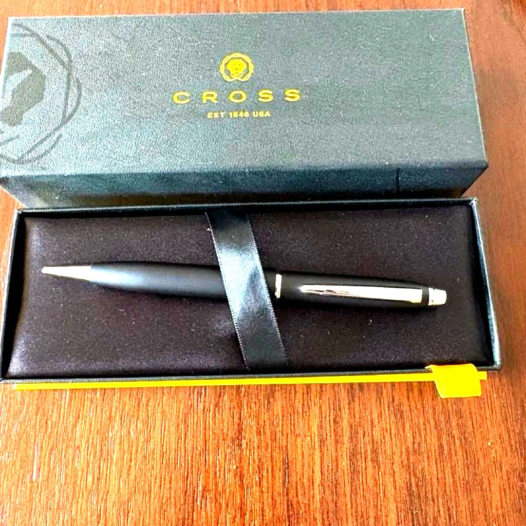 Cross black metal ballpoint pen with a dedicated black case on a white background