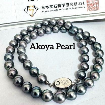Akoya pearl necklace 42cm with natural white pearls and a silver clasp on white background