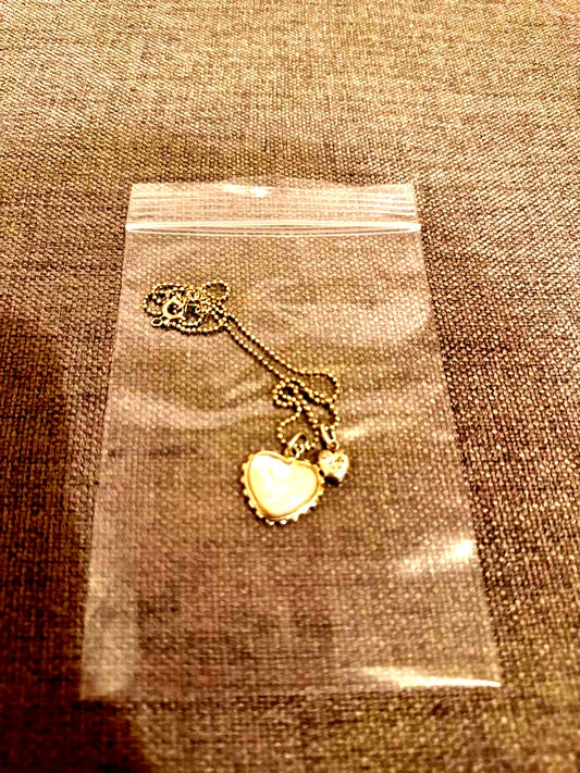 Agete white mother-of-pearl reversible heart-shaped necklace on a chain