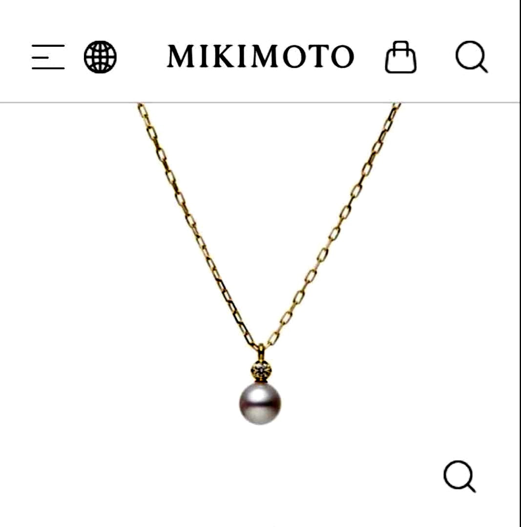 MIKIMOTO 18K gold necklace with pearl and diamond decorations displayed in a dedicated case