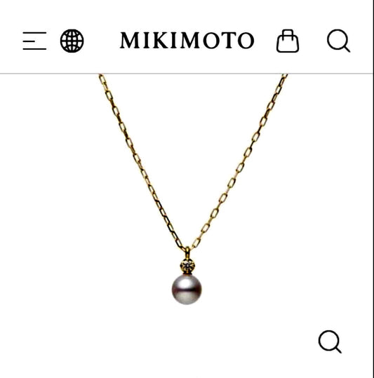 MIKIMOTO 18K gold necklace with pearl and diamond decorations displayed in a dedicated case