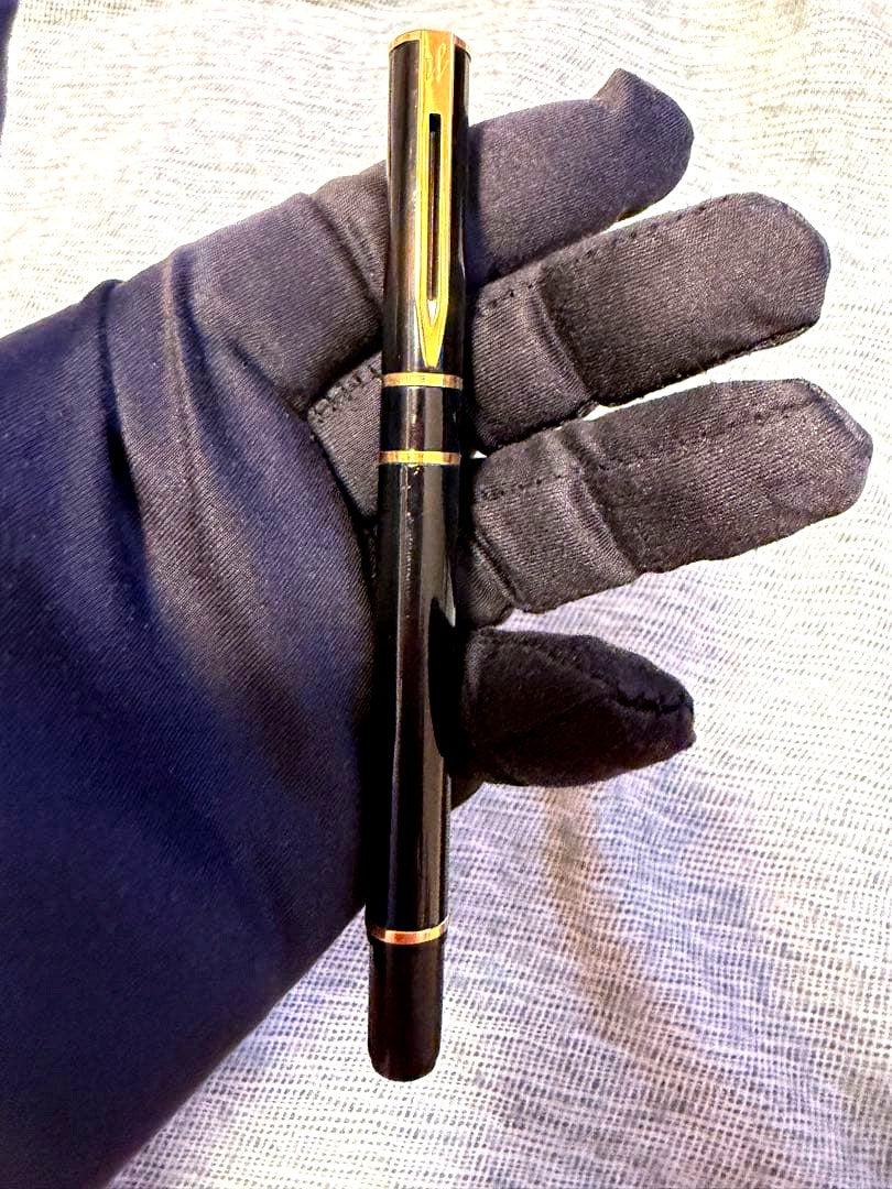 Black Waterman fountain pen with golden decorations and W logo on the cap
