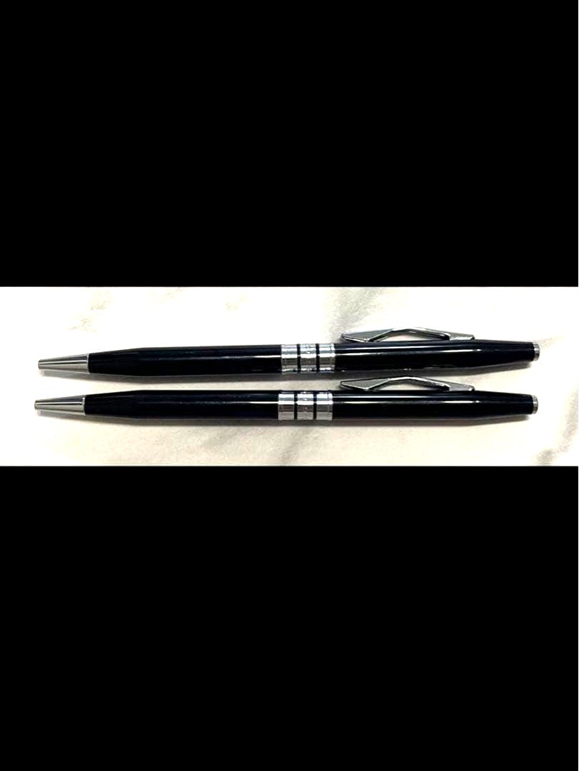 Pair of Cross ballpoint pens in used excellent condition displayed side by side