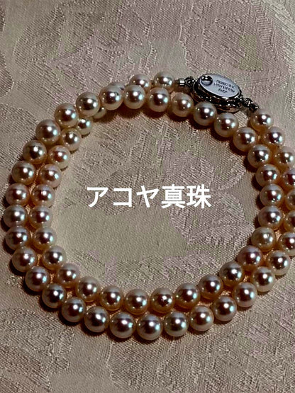 Akoya pearl necklace with 6.5-6.7mm white semi-round pearls and silver engraved bean-shaped clasp, 42.5cm length
