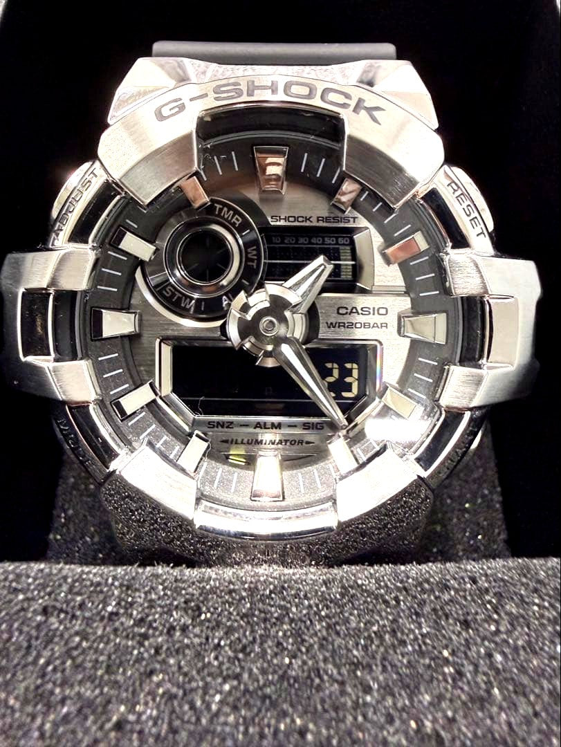 Casio G-Shock GM-700-1AJF Metal Covered Series watch with silver dial and resin band, shown with box and manual