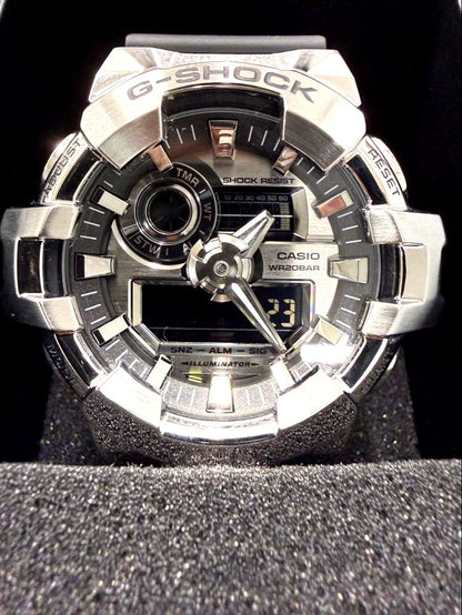 Casio G-Shock GM-700-1AJF Metal Covered Series watch with silver dial and resin band, shown with box and manual