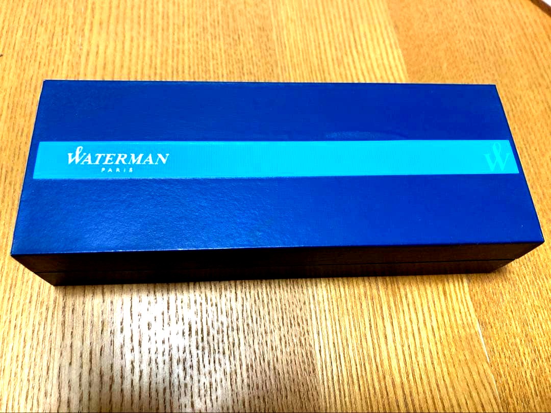 WATERMAN ballpoint pen with engraved organization name on the body, shown in close-up