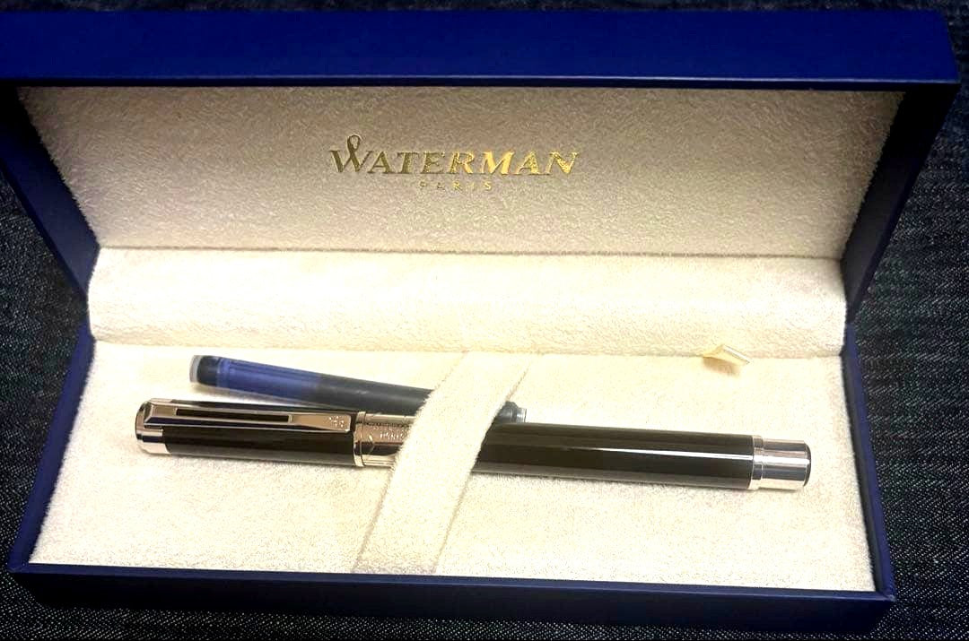 Waterman Perspectiv fountain pen with black body, silver trim, fine nib, and included case and ink cartridges