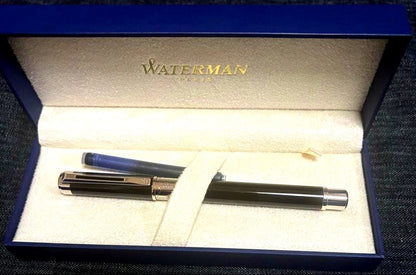 Waterman Perspectiv fountain pen with black body, silver trim, fine nib, and included case and ink cartridges