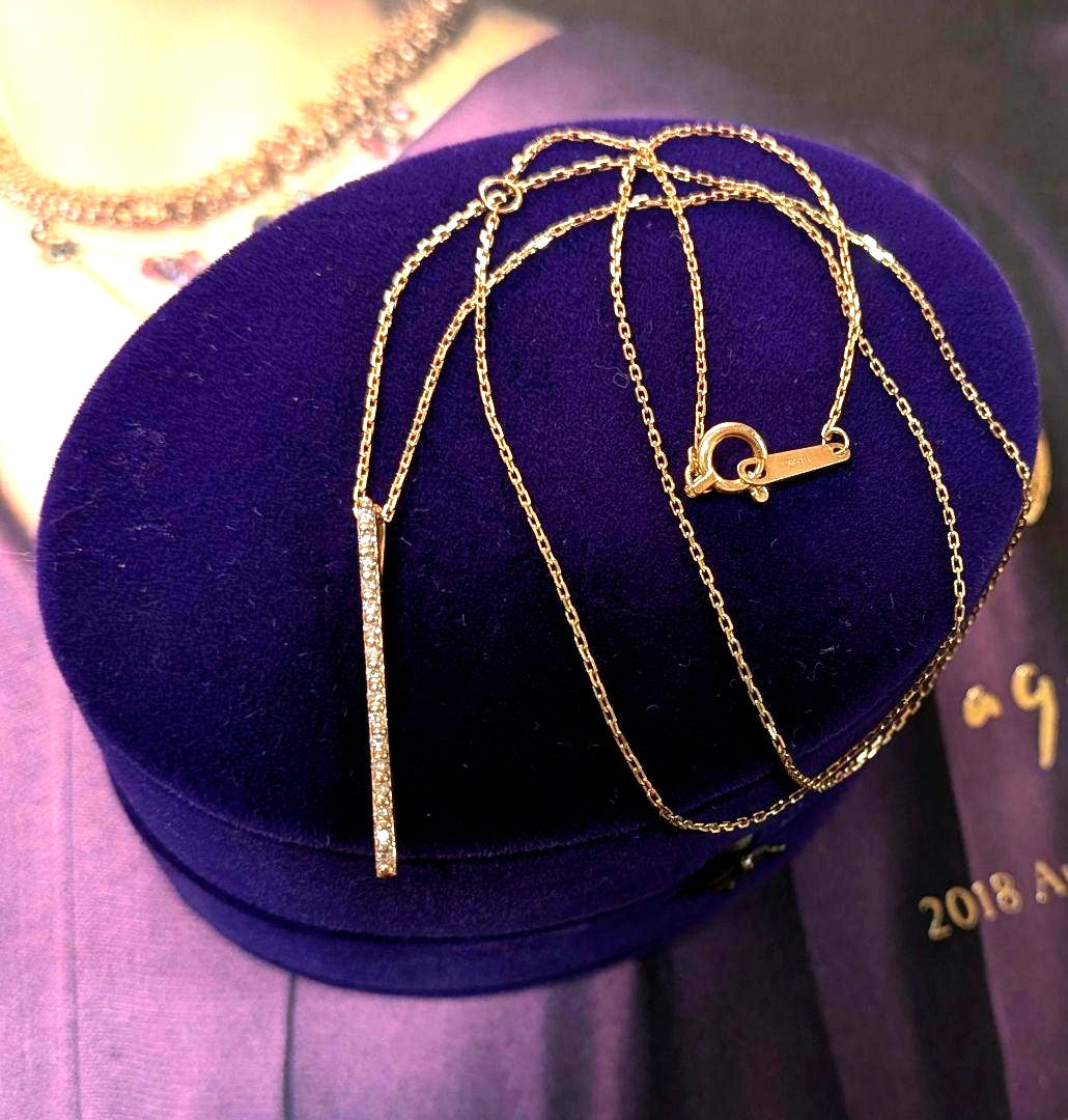 Agat K10 gold diamond bar necklace with 0.08 carat diamonds on a chain with engraving, displayed with box