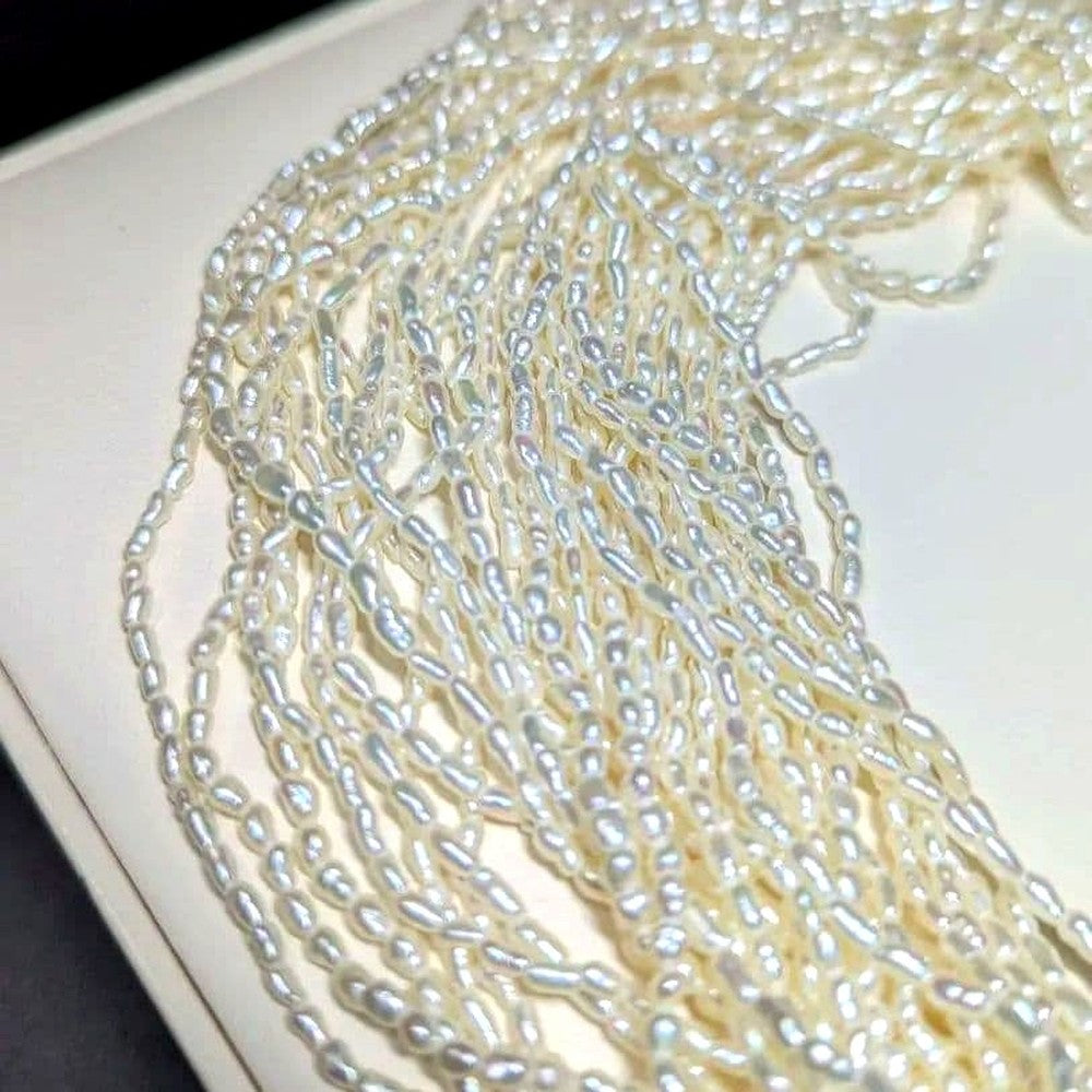 N107 Poppy 15-Strand Akoya Pearl Necklace with 2-4mm pearls and 62cm length displayed on a white background