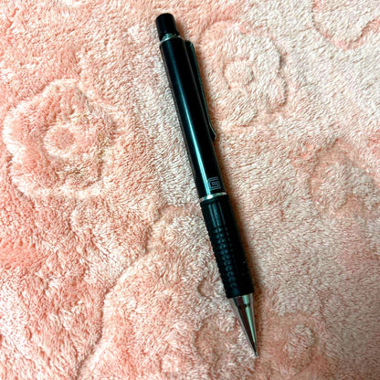 Pilot GIMNO Black pen featuring metal tip, rubber grip, and simple black plastic and metal body