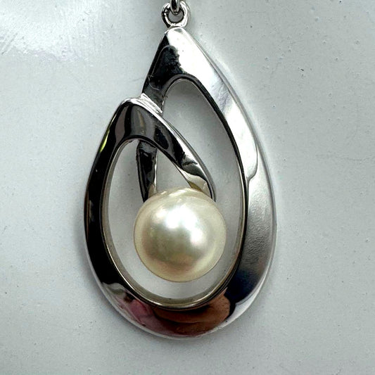 Mikimoto Akoya pearl necklace with silver teardrop pendant, silver chain, and red storage box