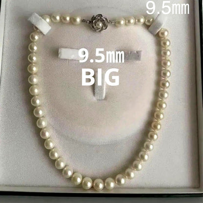 Vintage Akoya pearl necklace featuring a single 9.5 mm pearl and double lock clasp on a 44.5 cm chain