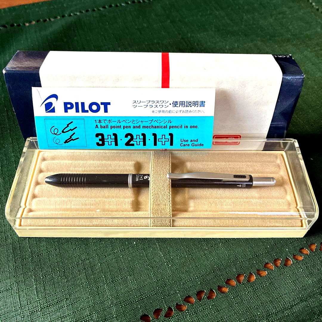 Pilot To plus One mechanical pencil and two-color ballpoint pens with visible storage wear