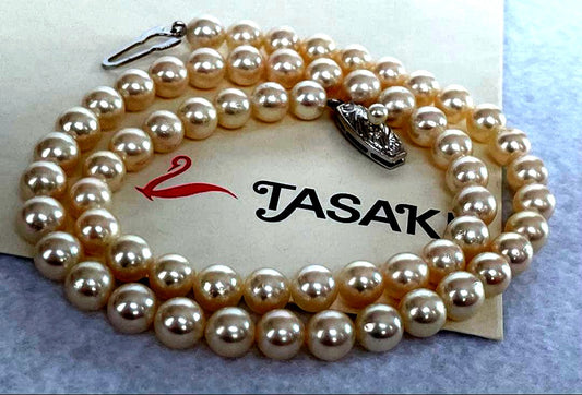 Antique Tasaki Akoya pearl necklace featuring 6.5mm round pearls on a 42cm string