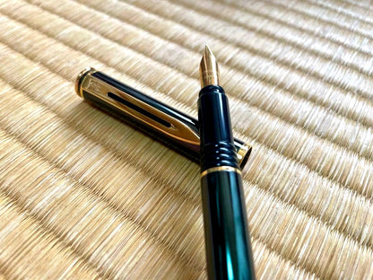 Waterman fountain pen made in France with deep green finish, classic design displayed on white background
