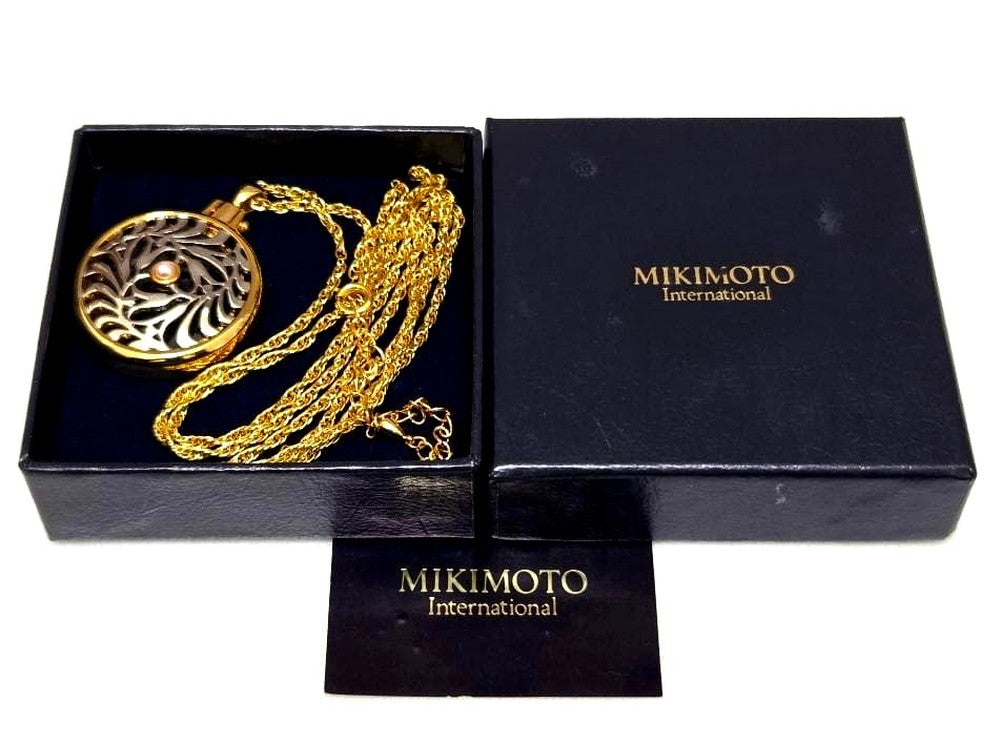 MIKIMOTO Pearl Pendant Loupe Long Necklace with pearl pendant displayed against white background with box
