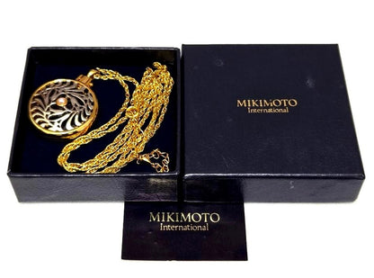 MIKIMOTO Pearl Pendant Loupe Long Necklace with pearl pendant displayed against white background with box