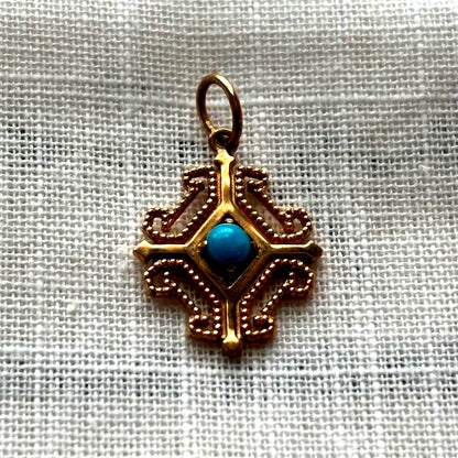 agete K10 gold pendant top with geometric frame and turquoise stone in pink gold tint