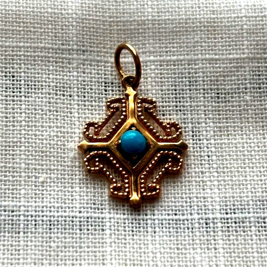 agete K10 gold pendant top with geometric frame and turquoise stone in pink gold tint