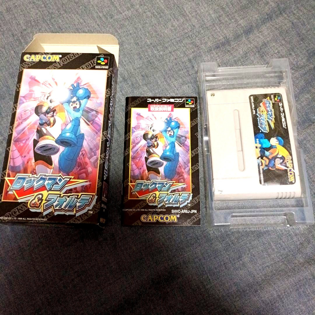Super Famicom Rockman & Forte game cartridge with outer box and manual by CAPCOM