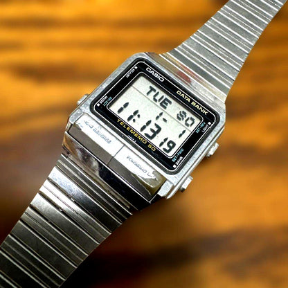 Casio Data Bank TELEMEMO 50 digital watch with silver metal strap showing digital display and date function