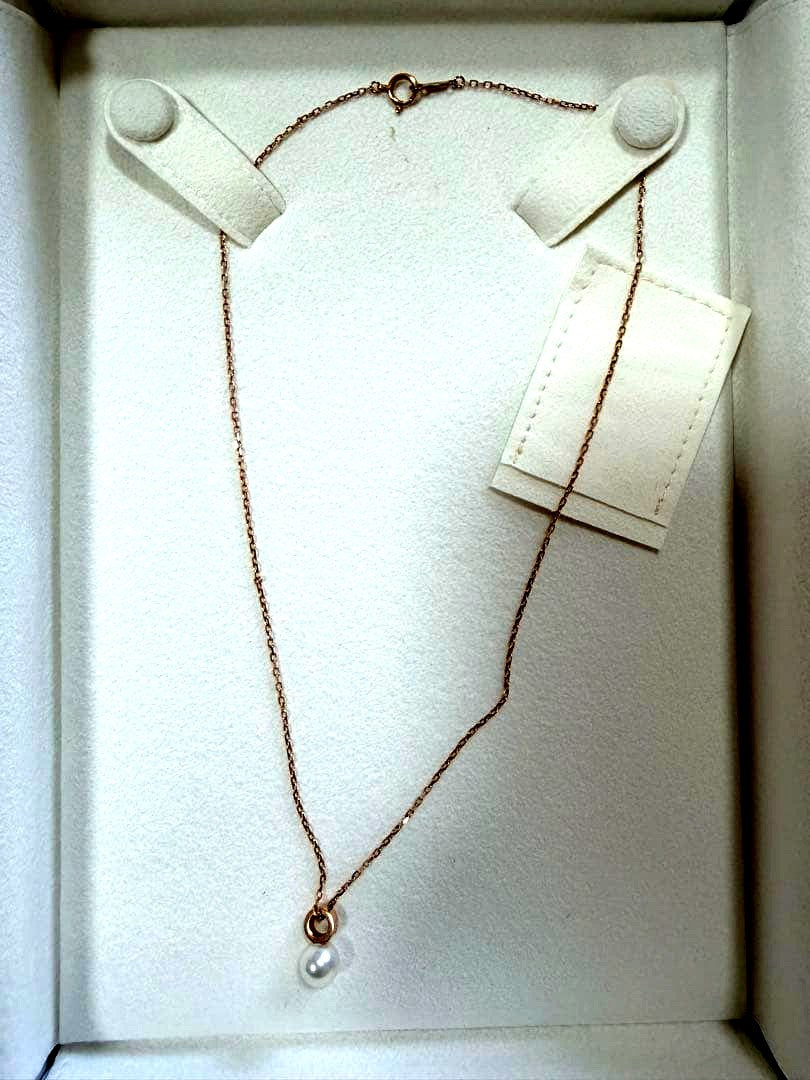 Mikimoto pink gold chain necklace with a single pearl pendant on white background