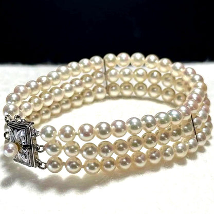 3-strand Akoya pearl bracelet with 5-5.5mm white to light pink pearls and silver clasp