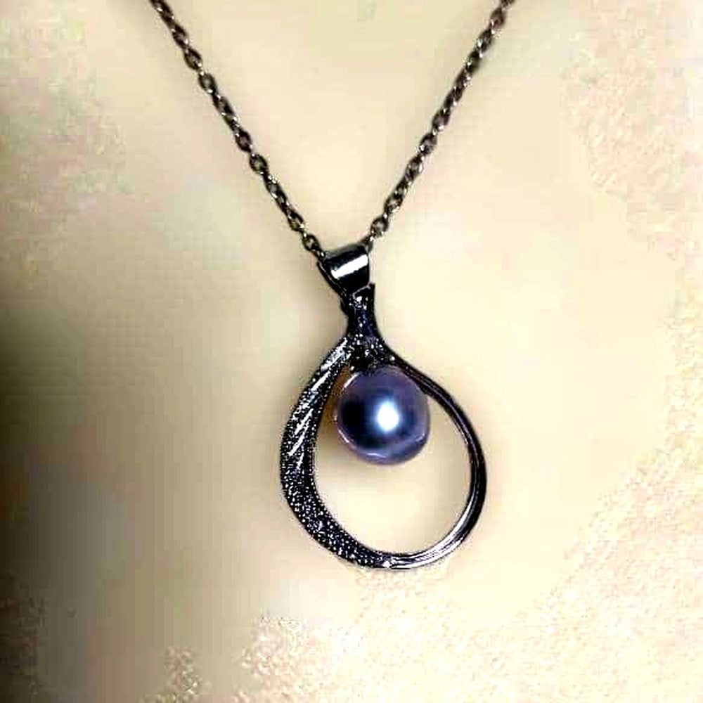 Mikimoto silver pendant necklace with a single 6mm pearl on a delicate chain