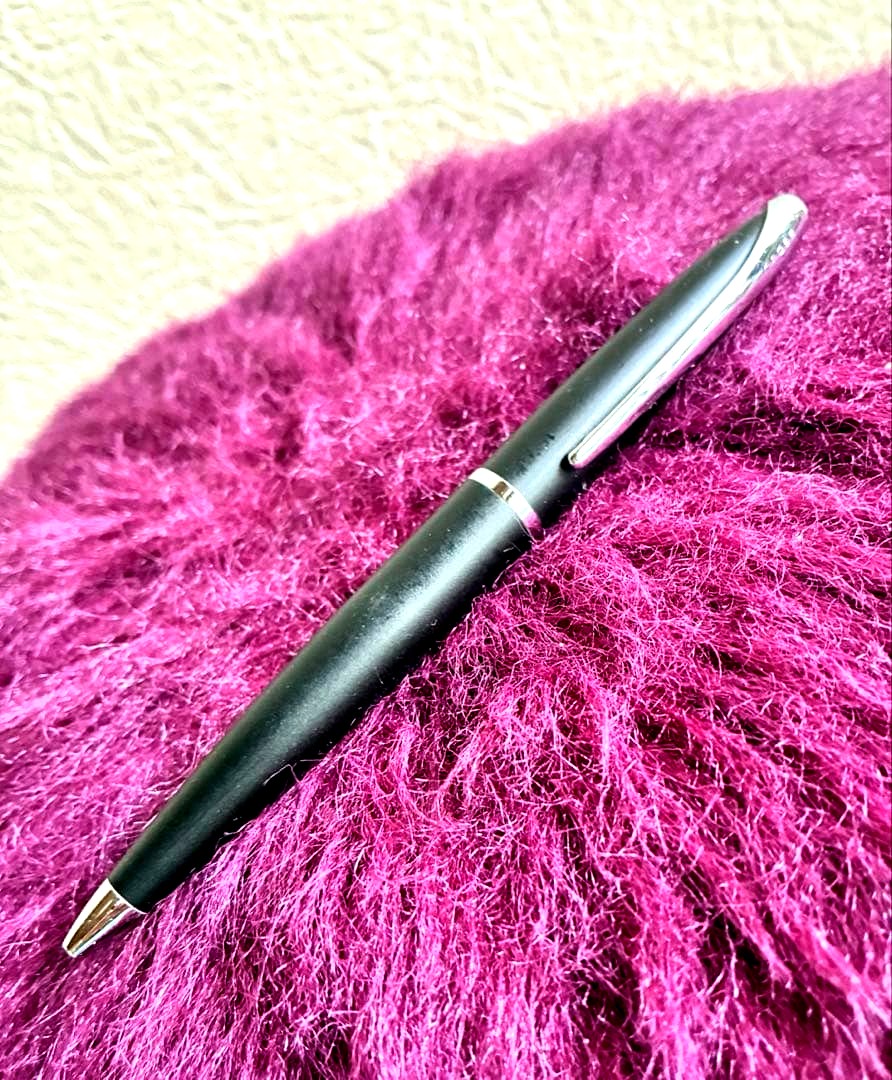 Cross black ballpoint pen with simple, sleek design shown against white background
