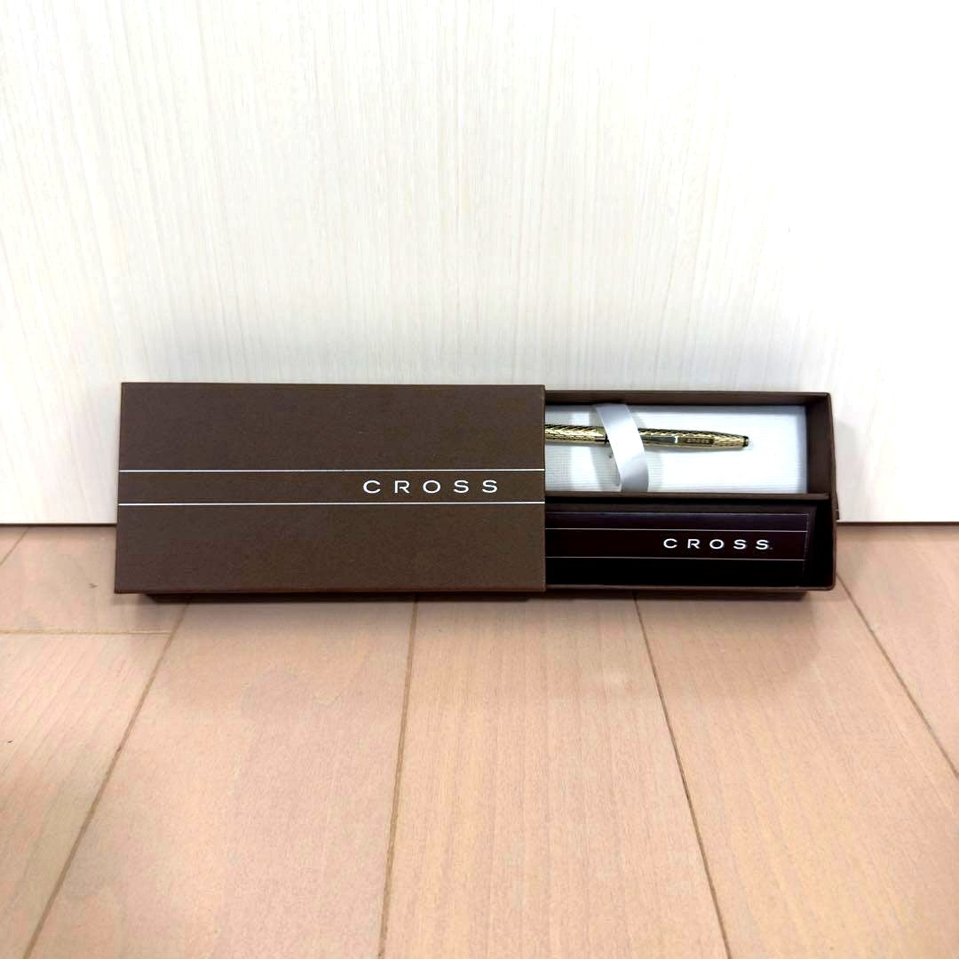 Cross Gold Diamond Cut Ballpoint Pen with twist mechanism and original box on white background