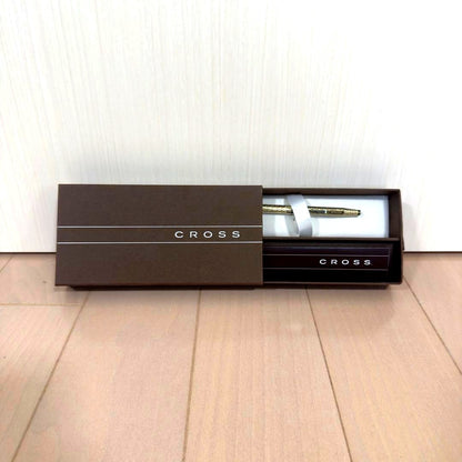 Cross Gold Diamond Cut Ballpoint Pen with twist mechanism and original box on white background